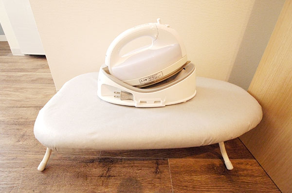 There is also an ironing board and an iron.