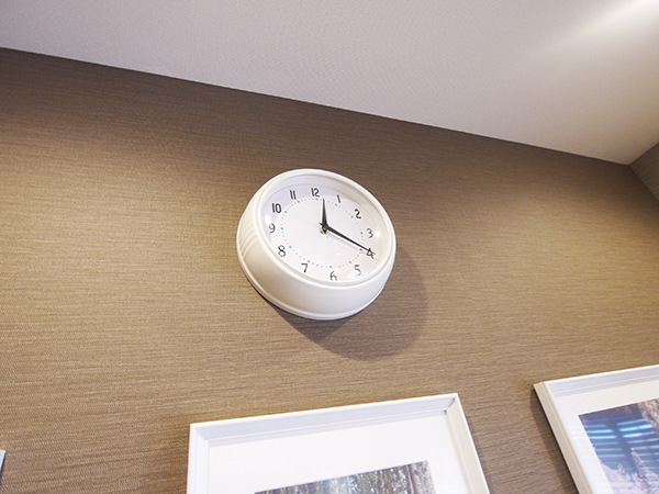 A clock in the living room that is simple and easy to see
