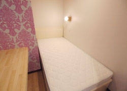 there is Fashionable pink wallpaper in room D.